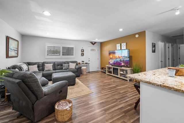 9181 Bloomdale St, Santee, CA 92071 - living room with dark wood finished floors and recessed lighting