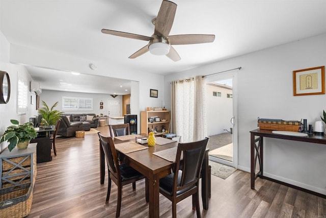 9181 Bloomdale St, Santee, CA 92071 - dining area featuring wood finished floors, ceiling fan, and an AC wall unit