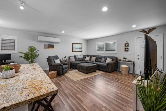 9181 Bloomdale St, Santee, CA 92071 - living room with a wall mounted air conditioner, wood finished floors, and recessed lighting