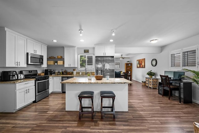 9181 Bloomdale St, Santee, CA 92071 - kitchen featuring stainless steel appliances, a kitchen island, white cabinetry, and recessed lighting