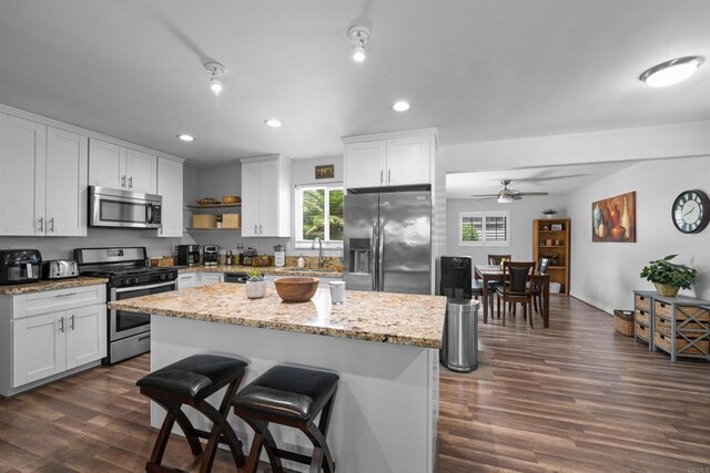 9181 Bloomdale St, Santee, CA 92071 - kitchen featuring appliances with stainless steel finishes, recessed lighting, ceiling fan, white cabinets, and dark wood-style floors