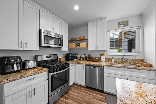 9181 Bloomdale St, Santee, CA 92071 - kitchen with stainless steel appliances, recessed lighting, white cabinetry, dark wood finished floors, and open shelves