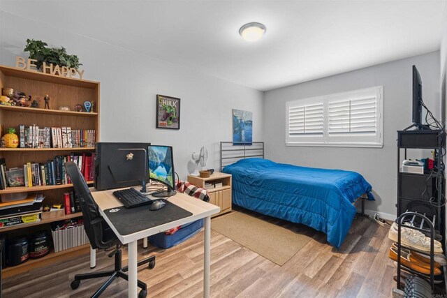 9181 Bloomdale St, Santee, CA 92071 - bedroom featuring wood finished floors and an office area