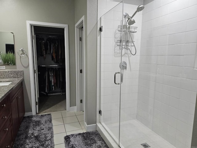 7508 Eagle Dr, Santee, CA 92071 - full bath with a shower stall, vanity, a walk in closet, and tile patterned flooring