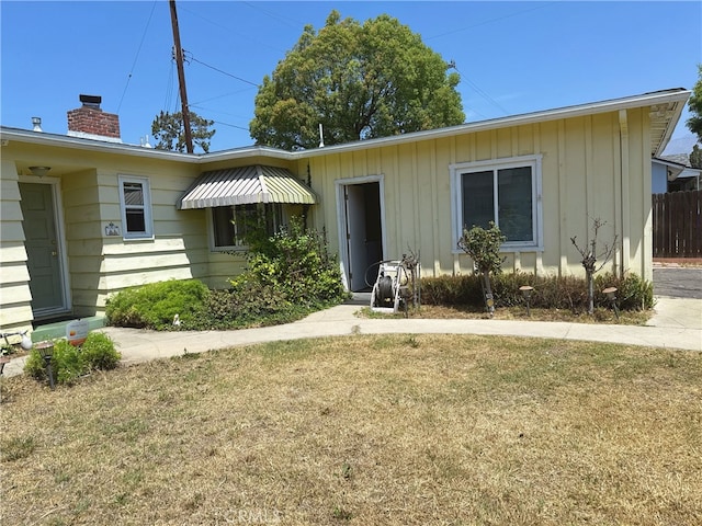 7135 Sultana Ave, San Gabriel, CA 91775 - view of front of house with a chimney and board and batten siding