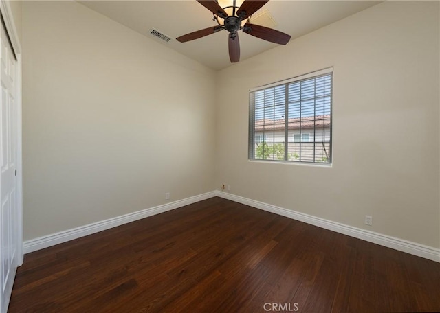 125 W Franklin Ave, Ridgecrest, CA 93555 - spare room featuring dark wood-style floors, vaulted ceiling, and a ceiling fan