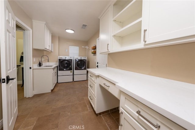 125 W Franklin Ave, Ridgecrest, CA 93555 - laundry room with separate washer and dryer, stone finish flooring, a desk, and cabinet space