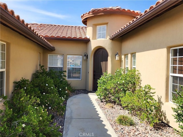 125 W Franklin Ave, Ridgecrest, CA 93555 - property entrance with a tiled roof and stucco siding