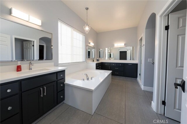 125 W Franklin Ave, Ridgecrest, CA 93555 - full bath with two vanities, a garden tub, and tile patterned flooring