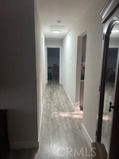 942 Front St, Perris, CA 92570 - hall featuring light wood finished floors and baseboards