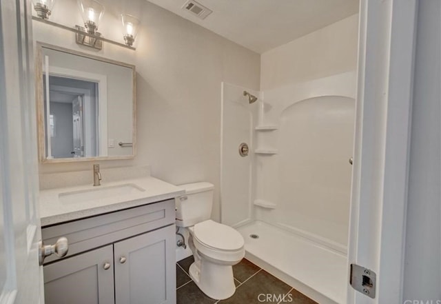 942 Front St, Perris, CA 92570 - bathroom featuring tile patterned flooring, vanity, and a shower