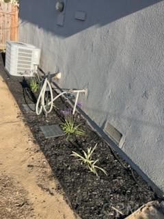 942 Front St, Perris, CA 92570 - exterior view of stucco siding and a cooling unit
