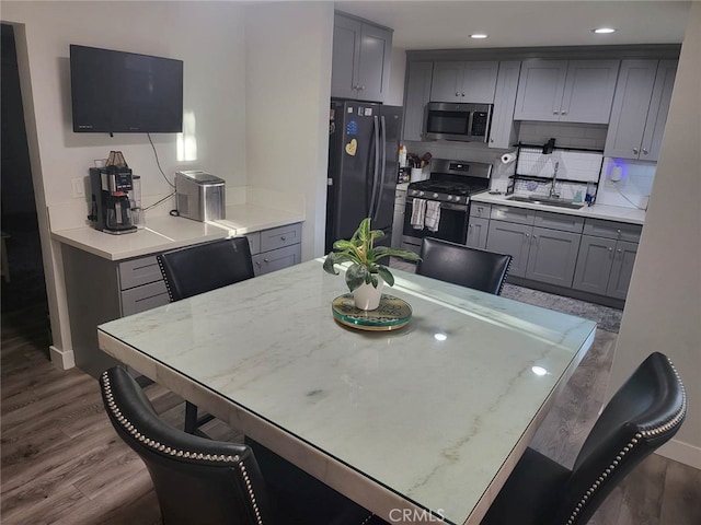 942 Front St, Perris, CA 92570 - dining area featuring dark wood-type flooring and recessed lighting