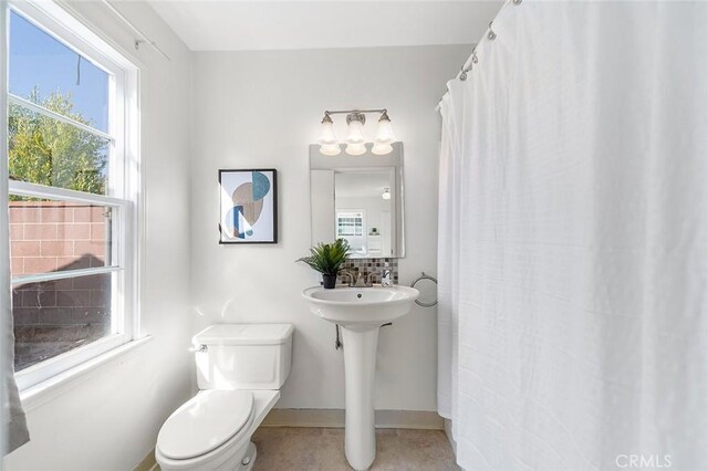 1872 Tulane Ave, Long Beach, CA 90815 - full bathroom with toilet and a shower with shower curtain