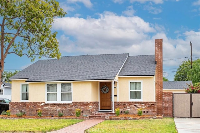 1872 Tulane Ave, Long Beach, CA 90815 - bungalow with stucco siding, brick siding, roof with shingles, and a gate