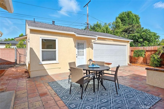 1872 Tulane Ave, Long Beach, CA 90815 - view of patio / terrace featuring a garage and outdoor dining area