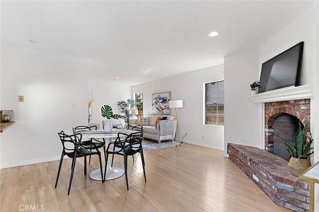 1872 Tulane Ave, Long Beach, CA 90815 - dining room with light wood-style floors, a fireplace, and recessed lighting