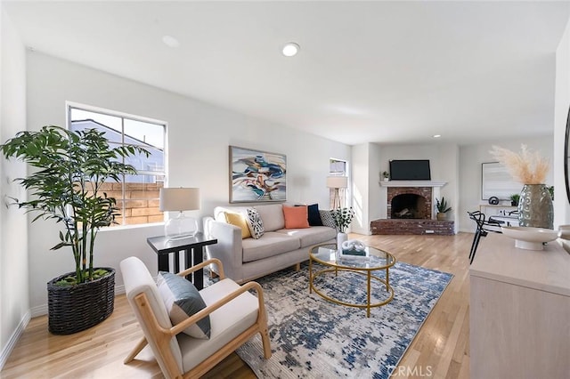 1872 Tulane Ave, Long Beach, CA 90815 - living room featuring light wood-type flooring, a brick fireplace, and recessed lighting