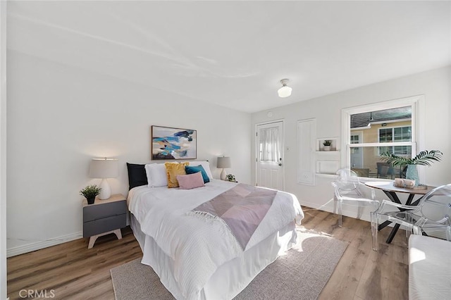 1872 Tulane Ave, Long Beach, CA 90815 - bedroom featuring multiple windows and wood finished floors