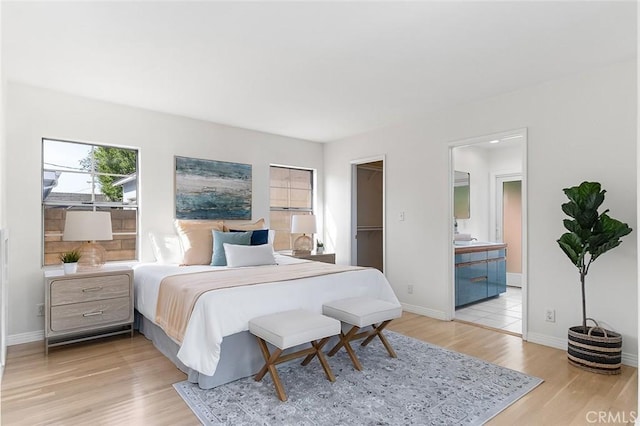 1872 Tulane Ave, Long Beach, CA 90815 - bedroom with light wood-style floors, connected bathroom, and a walk in closet
