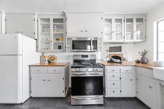 1872 Tulane Ave, Long Beach, CA 90815 - kitchen with stainless steel appliances, white cabinets, glass insert cabinets, and decorative backsplash