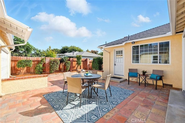 1872 Tulane Ave, Long Beach, CA 90815 - fenced backyard with a patio area and outdoor dining area