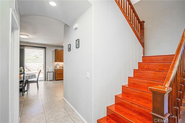 6221 Ruby Crest Way, Jurupa Valley, CA 91752 - stairway featuring tile patterned floors and arched walkways