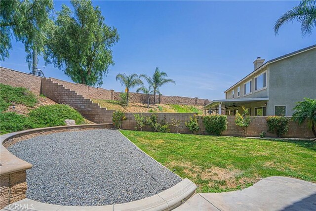 6221 Ruby Crest Way, Jurupa Valley, CA 91752 - fenced backyard featuring a patio