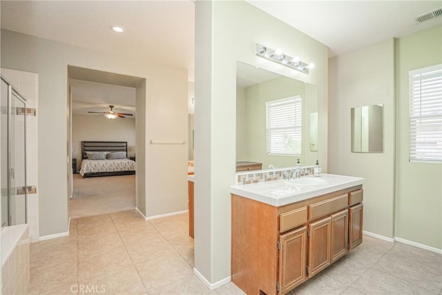 6221 Ruby Crest Way, Jurupa Valley, CA 91752 - bathroom featuring connected bathroom, a ceiling fan, tiled shower, vanity, and tile patterned flooring