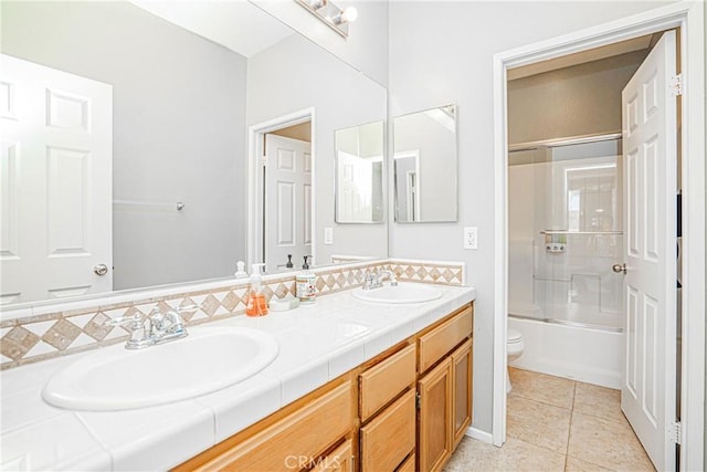 6221 Ruby Crest Way, Jurupa Valley, CA 91752 - bathroom featuring double vanity, tile patterned flooring, and bath / shower combo with glass door