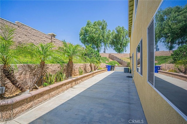 6221 Ruby Crest Way, Jurupa Valley, CA 91752 - fenced backyard featuring a patio