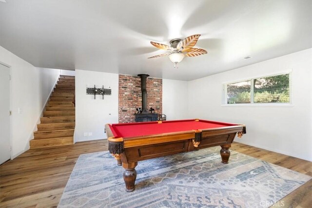 7635 Sombrilla Ave, Atascadero, CA 93422 - game room featuring a wood stove, ceiling fan, wood finished floors, and pool table
