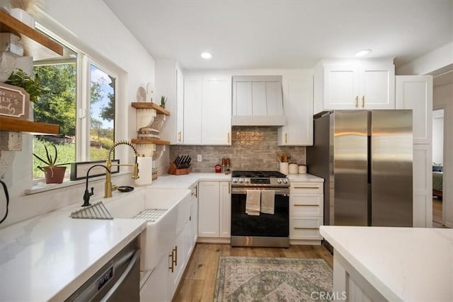 7635 Sombrilla Ave, Atascadero, CA 93422 - kitchen featuring stainless steel appliances, custom exhaust hood, open shelves, white cabinetry, and recessed lighting