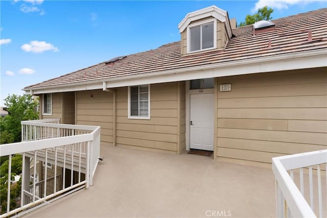 20331 Bluffside Unit A408, Huntington Beach, CA 92646 - doorway to property with a tile roof