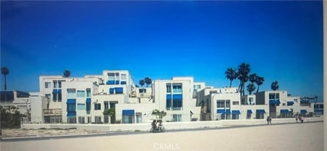 711 Pacific Coast Unit 109, Huntington Beach, CA 92648 - view of property with a residential view