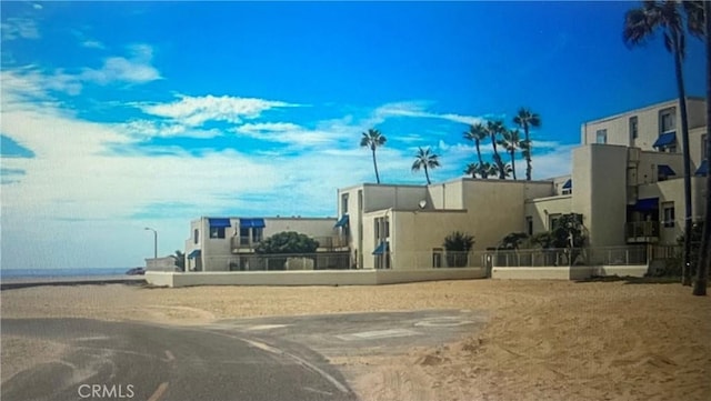 711 Pacific Coast Unit 109, Huntington Beach, CA 92648 - view of asphalt street featuring street lights