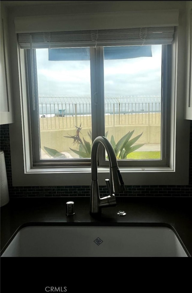 711 Pacific Coast Unit 109, Huntington Beach, CA 92648 - kitchen view of dark countertops and tasteful backsplash