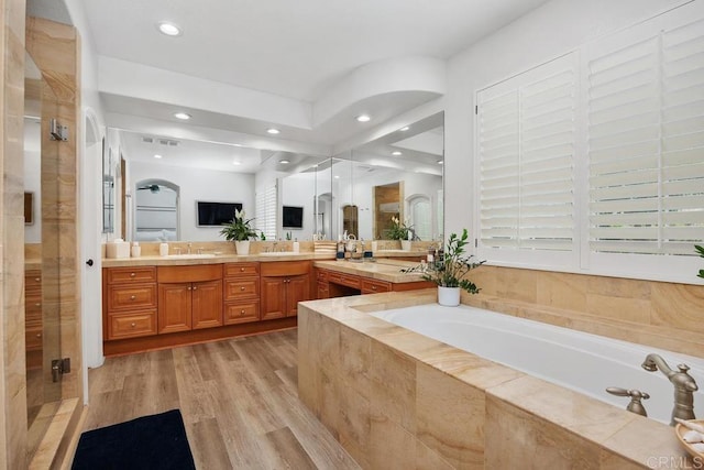 3239 Avenida La Cima, Carlsbad, CA 92009 - full bath with a garden tub, double vanity, a stall shower, wood finished floors, and recessed lighting