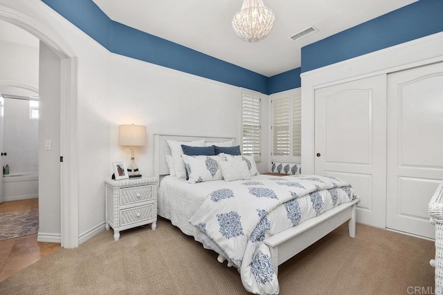 3239 Avenida La Cima, Carlsbad, CA 92009 - carpeted bedroom with a chandelier, a closet, and arched walkways
