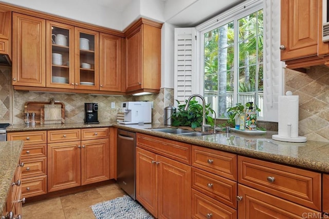 3239 Avenida La Cima, Carlsbad, CA 92009 - kitchen with dishwasher, brown cabinets, and light stone countertops