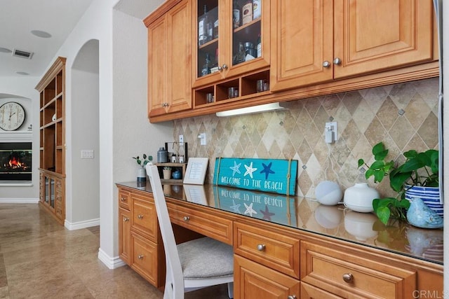 3239 Avenida La Cima, Carlsbad, CA 92009 - office space with a glass covered fireplace and arched walkways