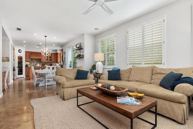 3239 Avenida La Cima, Carlsbad, CA 92009 - living area featuring a chandelier, ceiling fan, and recessed lighting