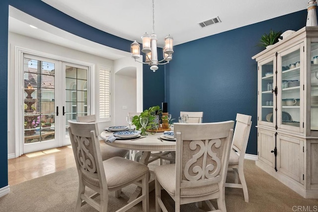 3239 Avenida La Cima, Carlsbad, CA 92009 - dining room with a chandelier, french doors, and arched walkways