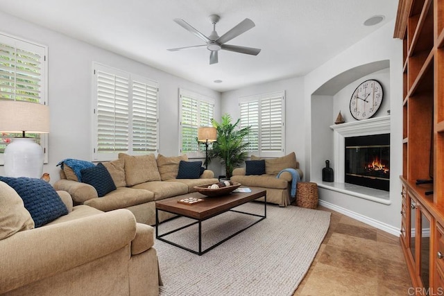 3239 Avenida La Cima, Carlsbad, CA 92009 - living room with ceiling fan, a glass covered fireplace, and arched walkways