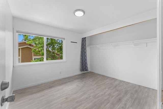 155 Countrywood Ln, Encinitas, CA 92024 - unfurnished bedroom featuring wood finished floors and a closet
