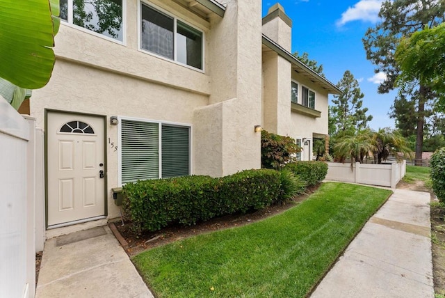 155 Countrywood Ln, Encinitas, CA 92024 - doorway to property featuring stucco siding and a chimney