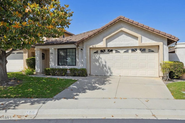 116 La Veta Dr, Camarillo, CA 93012 - ranch-style home featuring a garage, driveway, stucco siding, and a tiled roof