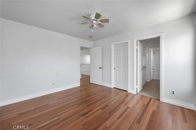 5 Vista Loreta, Lake Elsinore, CA 92532 - unfurnished bedroom featuring wood finished floors, ensuite bathroom, and a ceiling fan