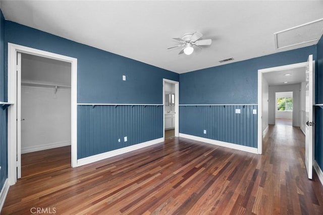 5 Vista Loreta, Lake Elsinore, CA 92532 - unfurnished bedroom featuring wood finished floors, attic access, a closet, a spacious closet, and a wainscoted wall