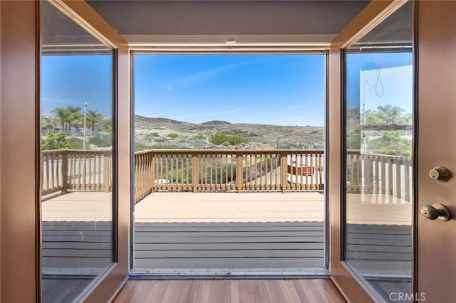 5 Vista Loreta, Lake Elsinore, CA 92532 - doorway to outside with wood finished floors, a mountain view, and plenty of natural light